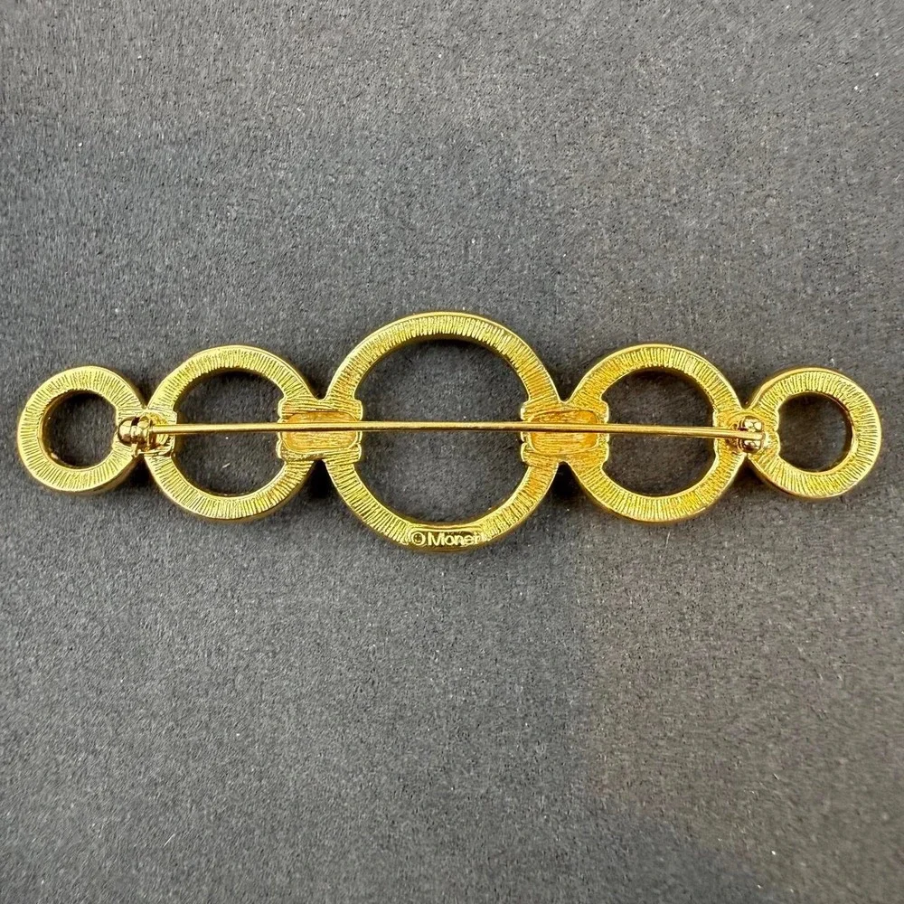 Monet Vintage Geometric Brooch Gold Tone Interlocking Circle Bar Design